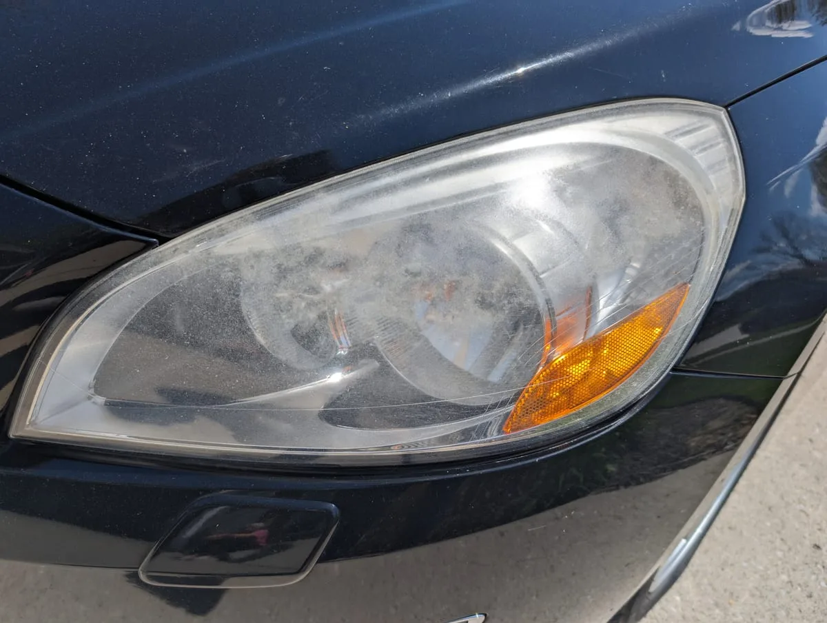 Before headlight restoration — yellowed headlight lens