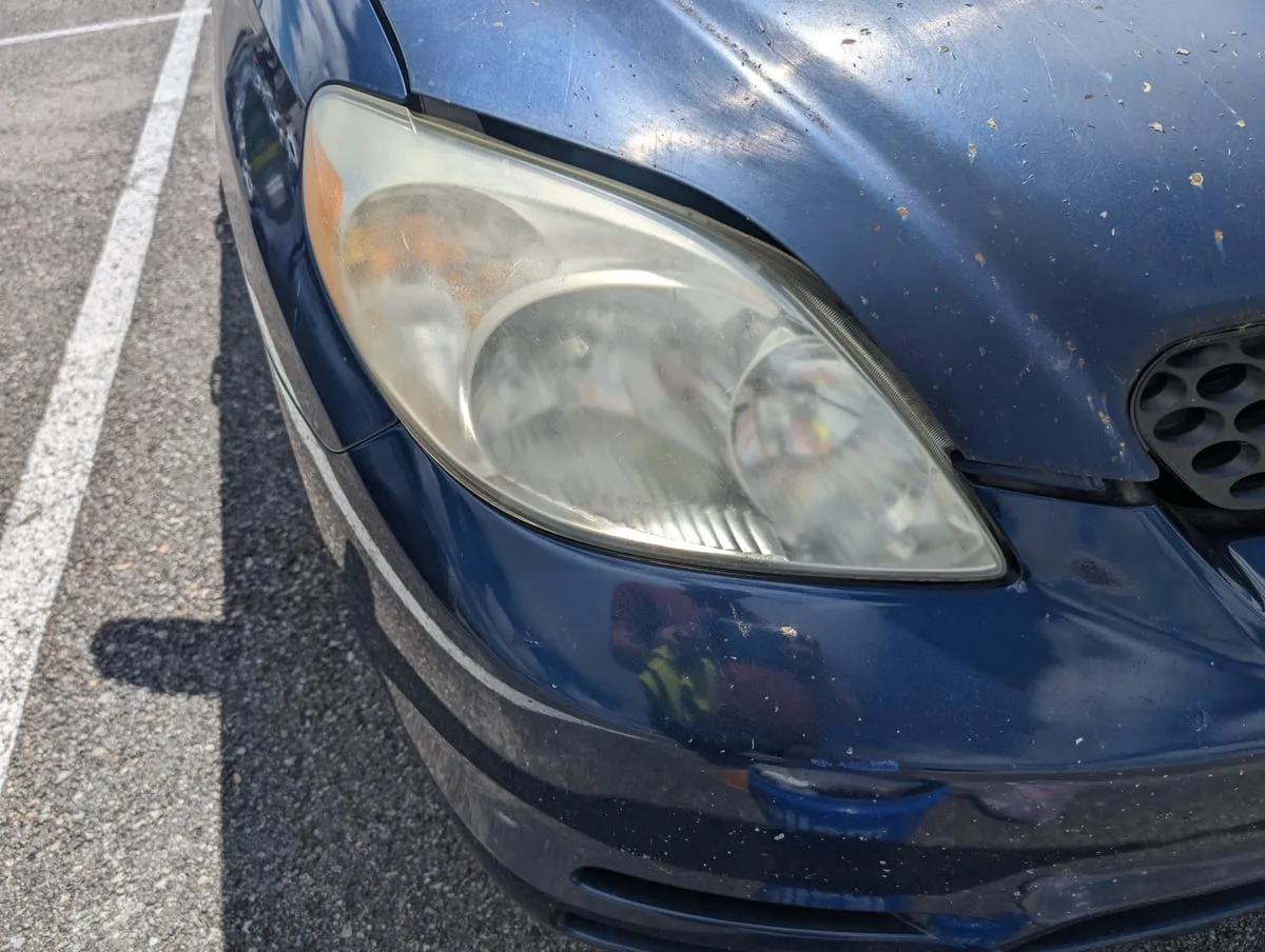 Before headlight restoration — cloudy headlight lens