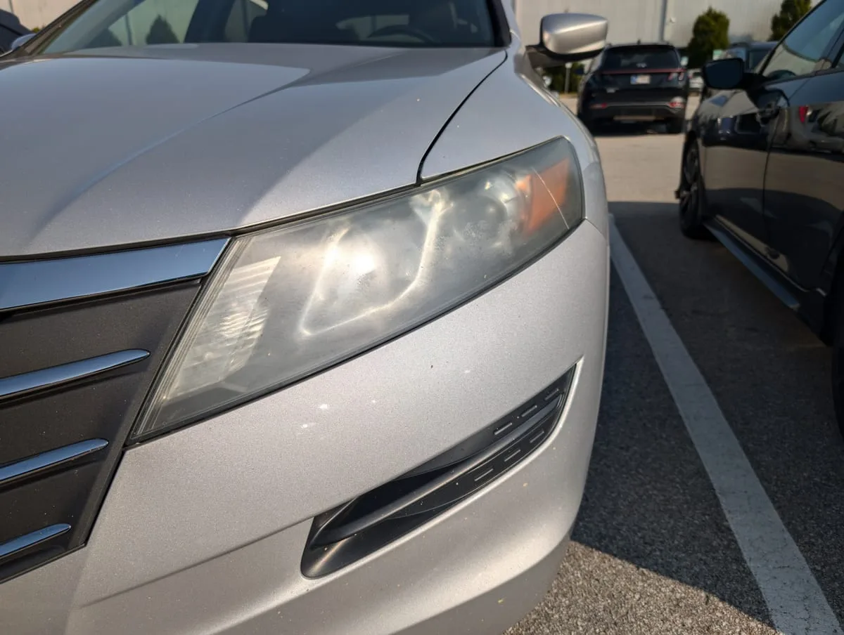 Before headlight restoration — hazy yellowed headlight