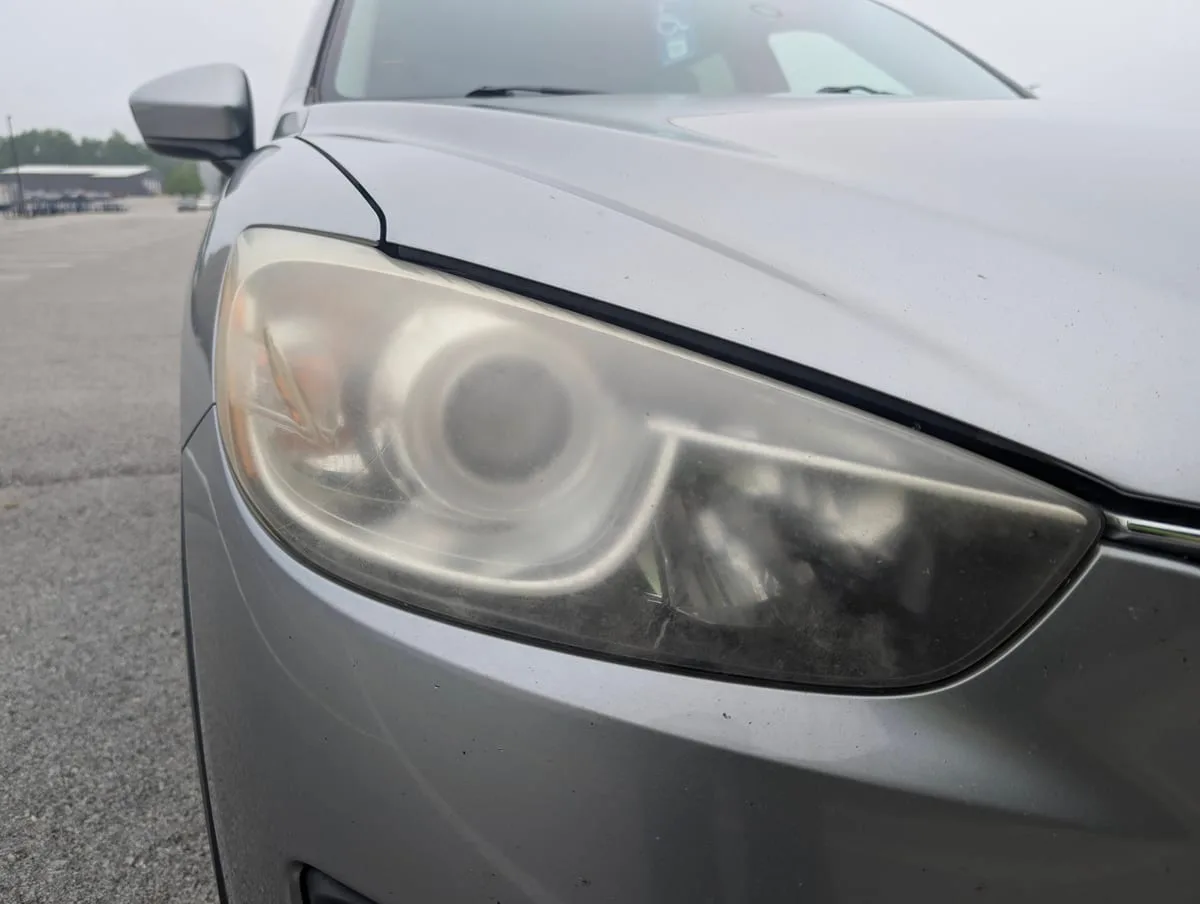 Before headlight restoration — faded headlight lens
