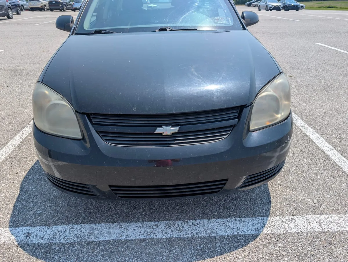 Before headlight restoration — severely oxidized headlight