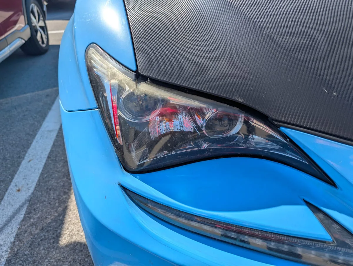 Before headlight restoration — foggy degraded headlight lens